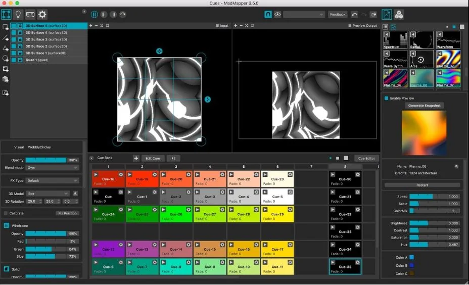 The MadMapper interface: surfaces list on the left, mapping canvas and preview output, a cue grid, and the material library